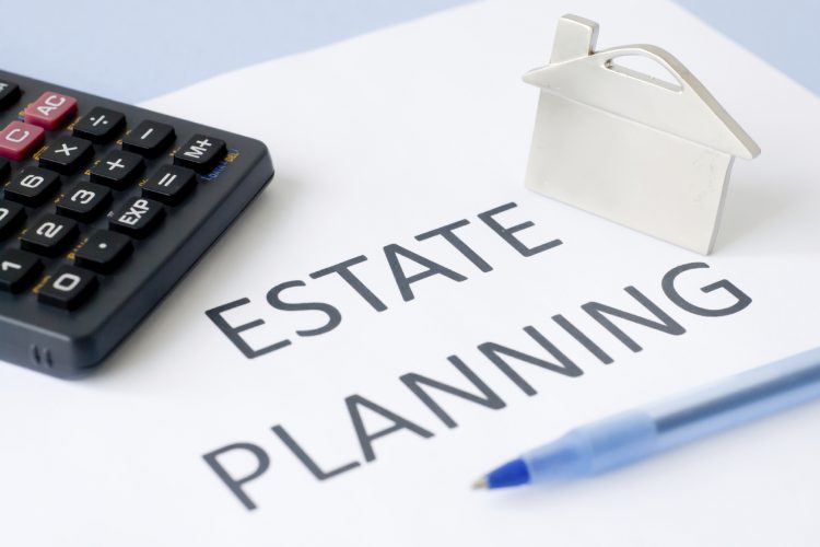 Estate planning documents and a calculator, representing South Africa's proposed changes to the donations tax exemption for property transferred between spouses